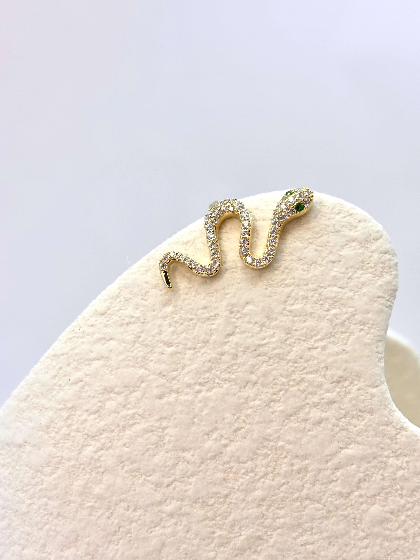 Free-spirited snake in gold