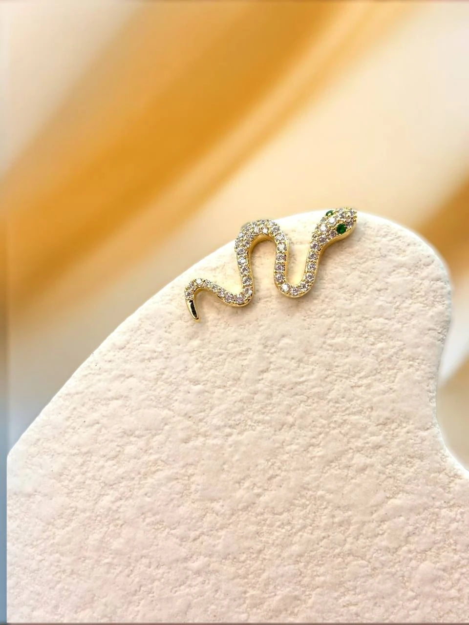 Free-spirited snake in gold