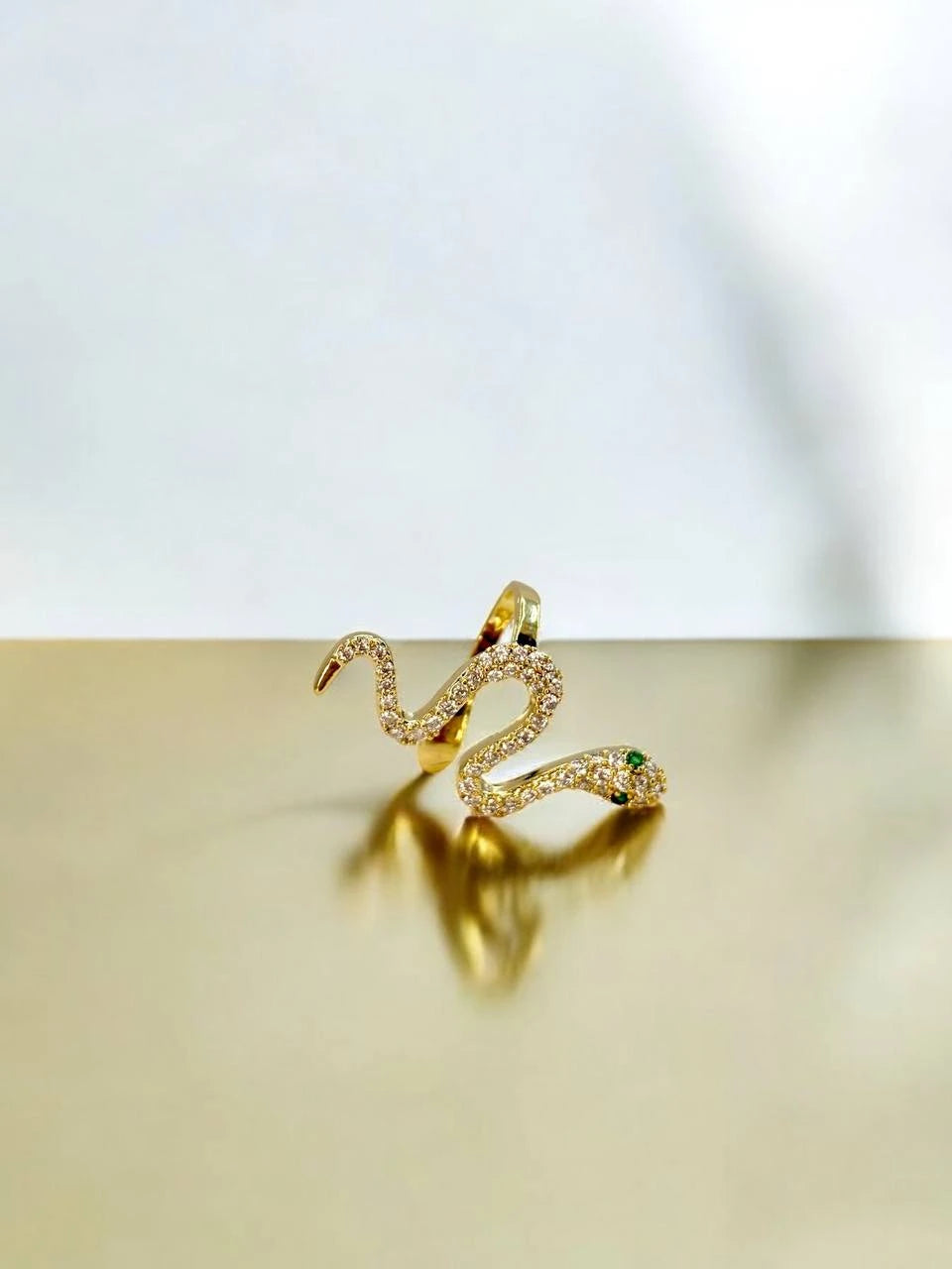 Free-spirited snake in gold