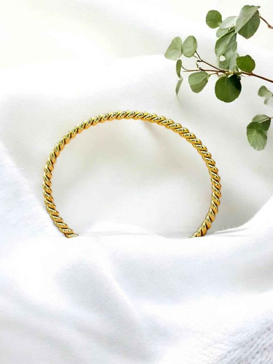 Twisted gold bangle
