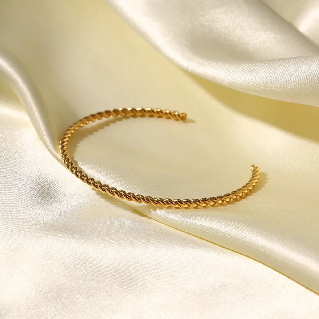 Twisted gold bangle