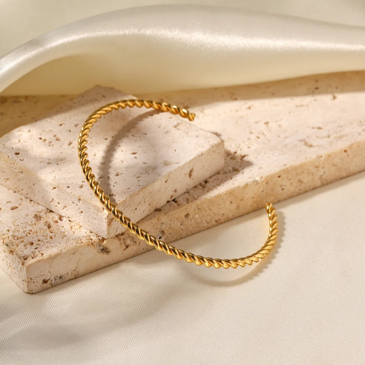 Twisted gold bangle